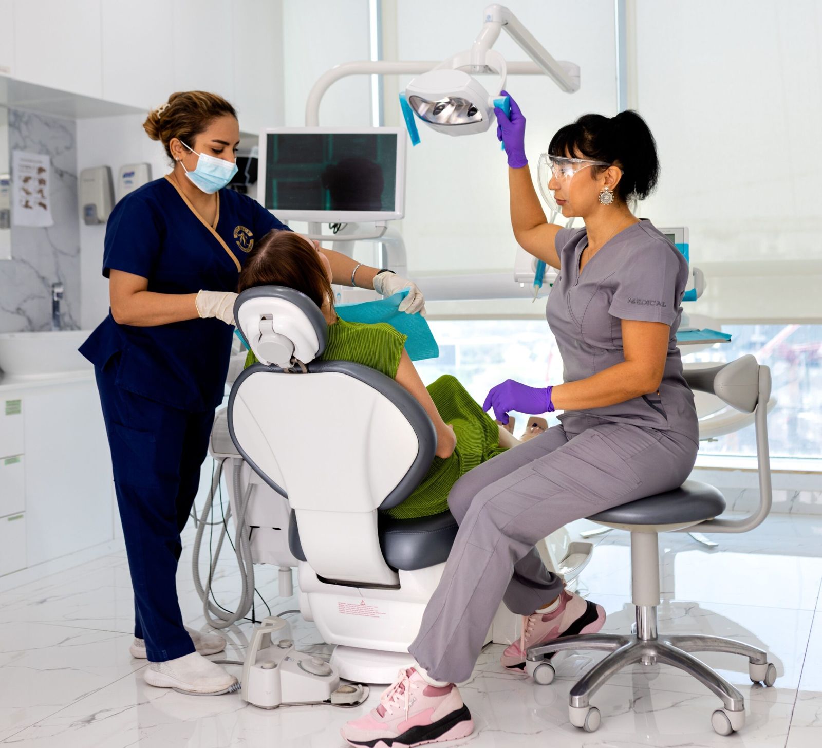 Dr Anahit treating a patient with her assistant at the clinic in JLT
